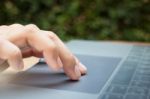 Woman Hand Using Laptop Touchpad Stock Photo