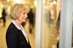 Businesswoman In Front Of A Store Window Stock Photo