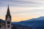 Belfry Of The Parish Church In Villanders At Sunrise Stock Photo