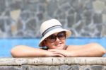 Beautiful Young Woman At A Pool Stock Photo