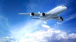 Airplane Flying In The Blue Sky Stock Photo