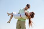 Man Carrying His Girlfriend Stock Photo