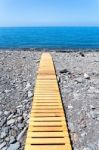 Wooden Footpath On Beach Leading To Portuguese Sea Stock Photo