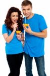 Couple Drinking Orange Juice Stock Photo