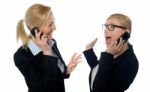 Businesswomen On Cellphones Stock Photo