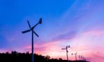 Wind Turbine On Sunset Twilight Time Stock Photo