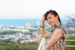 Woman Poses On A High Point Overlooking The City Stock Photo