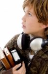 Student With Books And Headphone Stock Photo