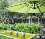 Flaxen Garden Umbrella In Summer Stock Photo