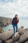 Woman On A Rock Near Cabo Da Roca In Portugal Stock Photo