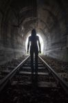 Man In A Tunnel Looking Towards The Light Stock Photo