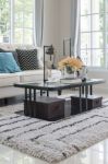 Glass Table With Vase Of Flower On Carpet In Classic Living Room Stock Photo