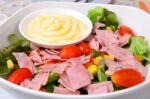 Fresh Salad With Ham In White Bowl Stock Photo