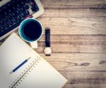 Office Desk With Coffee Background Stock Photo