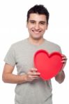 Casual Man Holding Heart Stock Photo