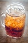 Glass Of Cola With Ice On Wooden Table Stock Photo