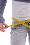 Female Measuring Her Waist With Tape Stock Photo