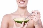 Cropped Picture Of Woman With Avocado Stock Photo