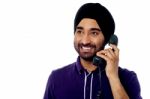 Smiling Indian Man On The Phone Stock Photo