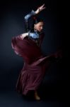 Young Flamenco Dancer In Beautiful Dress On Black Background Stock Photo