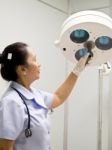 Nurse With Surgical Lamp Stock Photo