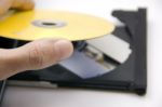 Loading A DVD Into The Player Stock Photo