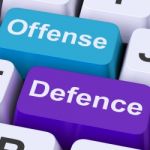 Offense Defence Keys Shows Attack Or Defend Stock Photo