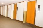 Elevators Orange Color In Hotel Lobby Stock Photo