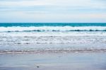 Sand Beach With Blue Ocean Stock Photo