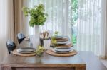 Modern Dinning Room With Wooden Table And Chair Stock Photo