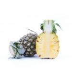 whole and halved Pineapple Stock Photo