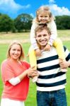 Smiling Family Enjoying In Outdoors Stock Photo