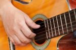 Guitar And Hand Stock Photo