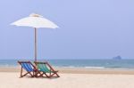 Beach Chairs And White Umbrella Stock Photo