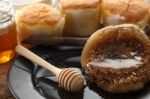 Wood Honey Dipper With Soft Cake Still Life Closeup Stock Photo