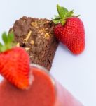 Strawberries And Brownie Indicates Juicy Afters And Fruity Stock Photo