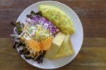 Omelet With Mix Salad And Thick Bread In White Plate Stock Photo