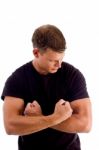 Young Man Showing His Muscles Stock Photo