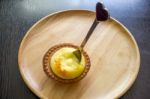 Portuguese Egg Tart On A Wood Dish Stock Photo