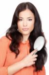 Woman Combing Her Hair Stock Photo