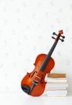 Violin And Book In Living Room Stock Photo