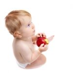 Cute Infant Boy With Apple Stock Photo