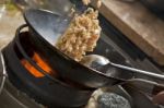 Stir fried rice being cooked in wok Stock Photo