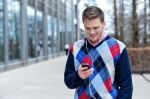 Handsome Man Listening To Music At Outdoors Stock Photo