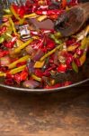 Fried Chili Pepper And Vegetable On A Wok Pan Stock Photo