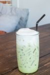 Green Tea Latte Into A Cold Glass Stock Photo