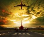 Passenger Plane Ready To Take Off On Airport Runways With Urban Stock Photo