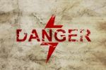 Danger Word On Grunge Wall Stock Photo