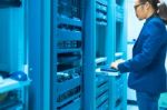 Man Fix Server Network In Data Center Room Stock Photo