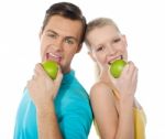 Couple Eating Green Apple Stock Photo